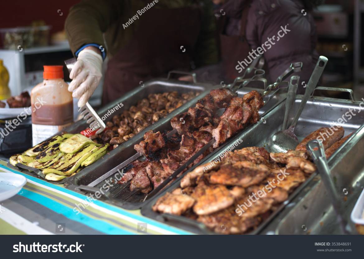 stock-photo-person-sells-fried-meet-at-the-fair-outdoors-353848691.jpg