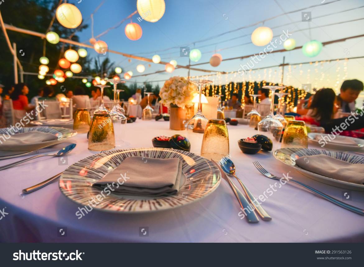 stock-photo-table-setting-for-an-event-party-or-wedding-reception-at-the-beach-291563126.jpg